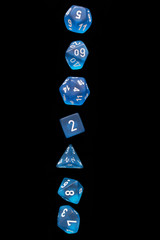 RPG set blue dice for playing role playing games on black blackground.