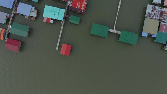 4K Aerial footage of local water village houses at Kg. Sim Sim water village Sandakan City, Sabah, Malaysia. Sandakan once known as Little Hong Kong of Borneo.