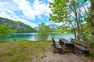 Beautiful Offensee lake landscape with mountains, forest, clouds and resting-place in Austrian Alps. Salzkammergut region.