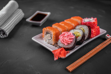 Rolla on the black old table with chopsticks