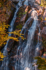 Fototapeta na wymiar Waterfall in the park. Rosa Khutor. Autumn view.