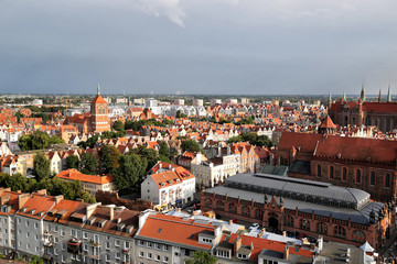 Naklejka premium Gdansk, Poland - 08.16.2019: View of the rooftops of the old city from the bell tower of the Cathedral of St. Katarzyna.