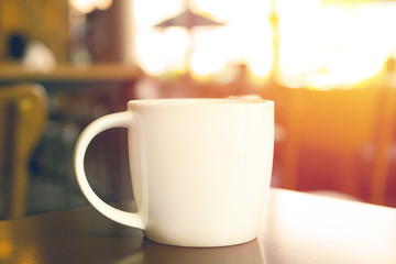 Hot coffee in white mug close up. vintage filter