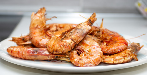 prawns baked in the foreground, fish after cooking