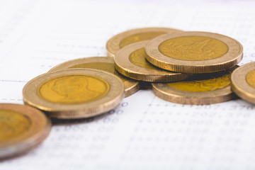 Money coins on book bank account