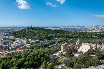 Fototapeta na wymiar Panorama of the city of Athens, with Odeo of Herod Atticus, Acropolis, Greece. Concept: classical culture, famous monuments, ancient history, cultural travel, visiting unesco world heritage