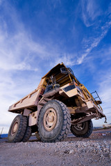 Heavy Construction Equipment Dump Truck against a blue sky
