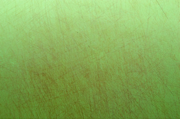 light green texture covered with brown scratches, dilapidated surface spoiled