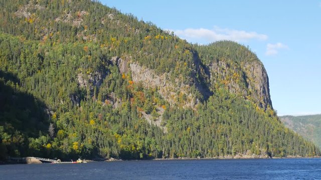 Wide view overlooking large body of water surrounded by big mountains