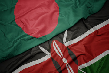 waving colorful flag of kenya and national flag of bangladesh.