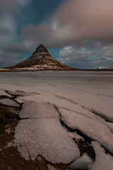 Famous mountain with waterfalls in Iceland, aurora borealis, night, kirkjufell, winter in Iceland, ice and snow, reflections, yellow grass, nature, icelandic famous landscape