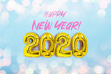 Golden air balloons numbers 2020 on a blue background with festive lights. Added text. The concept of the New Year, New Year's Eve, winter holidays. Flat lay, top view