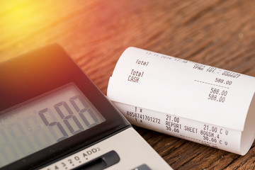 Grocery bill close up with calculator background