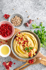 Chickpea hummus with tahini in a bowl. Healthy vegetarian appetizer. Middle Eastern cuisine