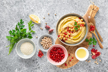 Chickpea hummus with tahini in a bowl. Healthy vegetarian appetizer. Middle Eastern cuisine