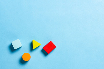 Children's educational toys geometric shapes for logic on a blue background. The concept of...