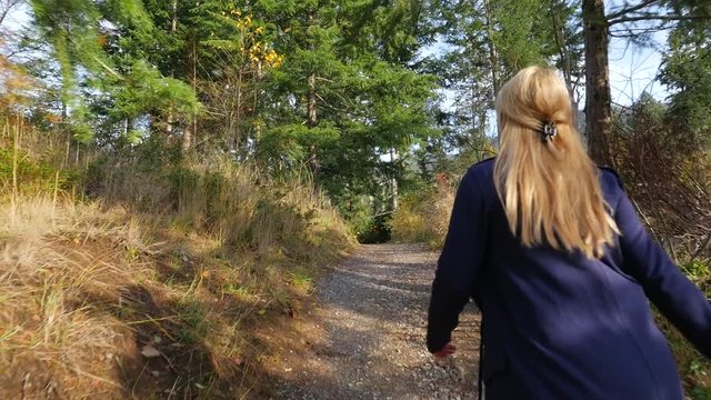 Young Female Hiking In Forest During The Fall In Nelson British Columbia 01