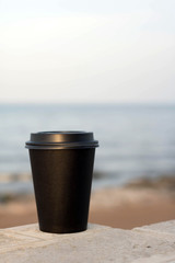 cup of coffee on the beach