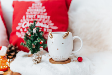Obraz na płótnie Canvas Christmas still life, cappuccino and decorations on festive light background.
