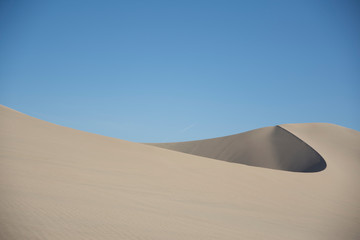Fototapeta na wymiar Sand dunes in la huacachina, ica desert, Peru