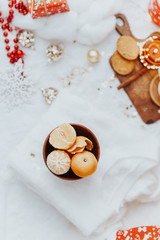 Obraz na płótnie Canvas Christmas cozy mood still life. Tangerine over white background
