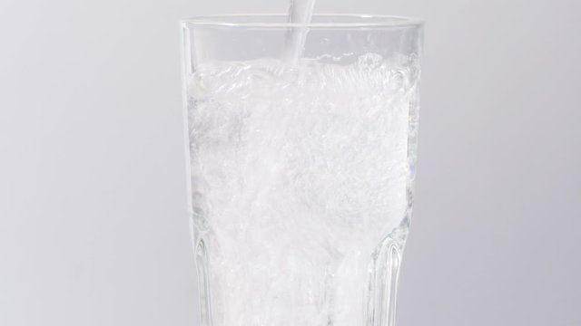 Pouring soda into a glass