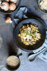 Vegetarian barley risotto with roasted mushrooms, fennel and Parmesan cheese slices