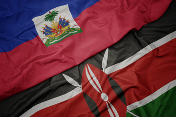 waving colorful flag of kenya and national flag of haiti.