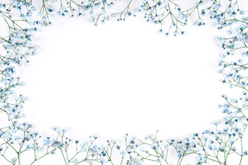 Beautiful flower frame of blue gypsophila flowers. Flat lay, top view. Floral pattern.