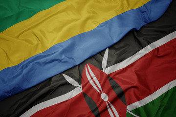 waving colorful flag of kenya and national flag of gabon.