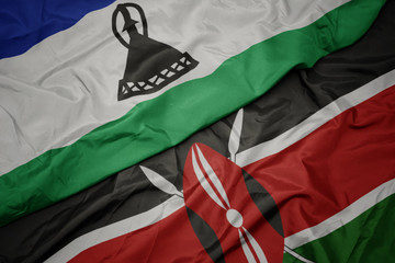 waving colorful flag of kenya and national flag of lesotho.