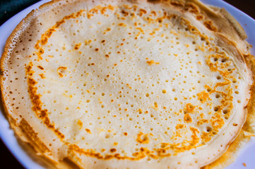 Rosy baked pancakes close-up.