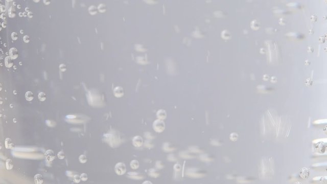 Bubbles in sparkling water close up