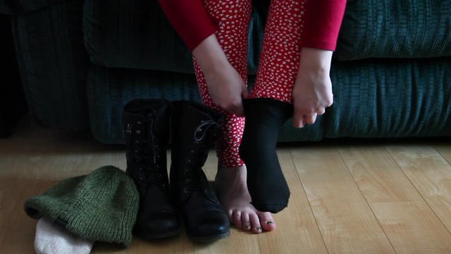 donning boots and socks 