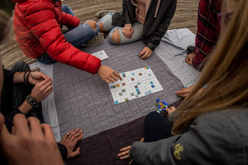 Group of people playing a board game.