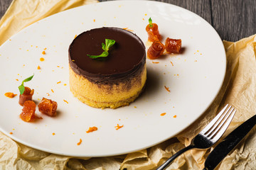 Dessert - Orange Cheesecake with orange marinade and Fresh mint close up