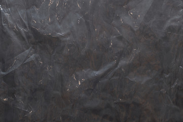 dark polyethylene texture with bruises and dust