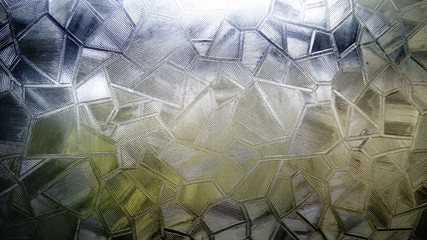 The effect of light refraction in corrugated glass on the window. Outside the window cloudy weather...