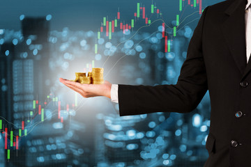 Double exposure businessman on trading graph and city background