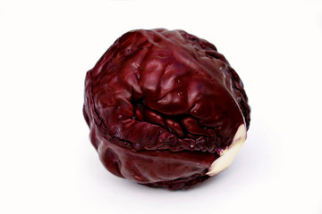 Whole ripe red cabbage on white background