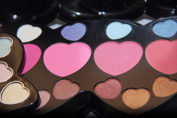 Decorative cosmetics in the shape of a heart: shadows, blush in a large set