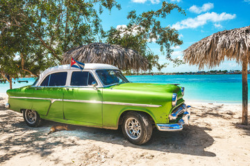 Playa La Herradura, Cuba - October 27, 2019: American classic car on the beach Playa La Herradura,...