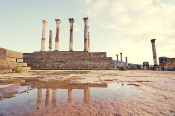 Beautiful sunset lanscape. The ruins of ancient antigue roman city Volubilis in Morocco, Africa.