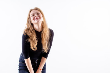 young beautiful blonde girl with a lovely shy smile on a white background