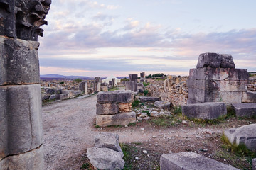 Beautiful sunset lanscape. The ancient antigue roman city Volubilis in Morocco, Africa.