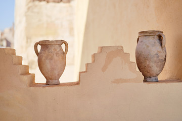 Ancient amphora jugs as decoration of the wall.