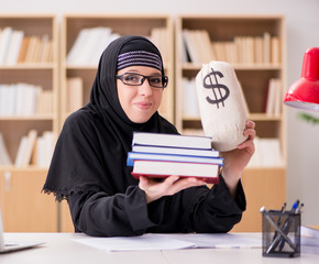 Muslim girl in hijab studying preparing for exams