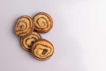 Home made cookies with chocolate, butter and vanilla, isolated on white background, soft light, angle view, copy space