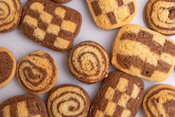 Home made cookies with chocolate, butter and vanilla, isolated on white background, soft light, angle view, copy space