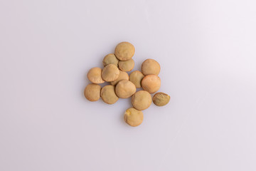 Dry uncooked lentils isolated on white background, copy space, studio shot, soft light. Christmas and New Year dish